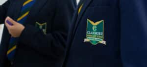 Clanmore crest on a school blazer. The crest reads "Passion for Learning"