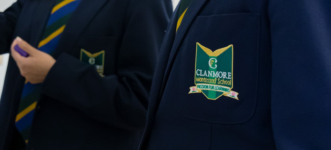 Clanmore crest on a school blazer. The crest reads "Passion for Learning"